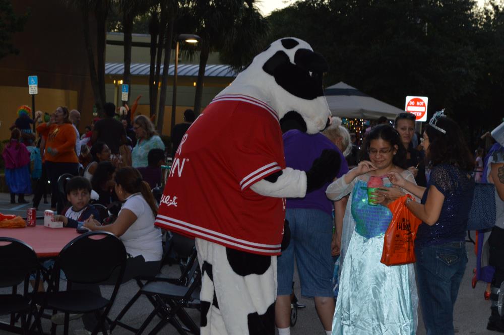 Chick-Fil-A Cow interacting with people at festival